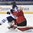 POPRAD, SLOVAKIA - APRIL 15: Finland's Olli Maansaari #36 crashes into Switzerland's Beat Trudel #30 during preliminary round action at the 2017 IIHF Ice Hockey U18 World Championship. (Photo by Andrea Cardin/HHOF-IIHF Images)

